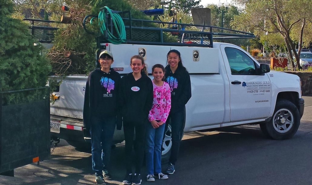 Girl Scouts from Troop #10240 in front of Gardeners' Guild truck